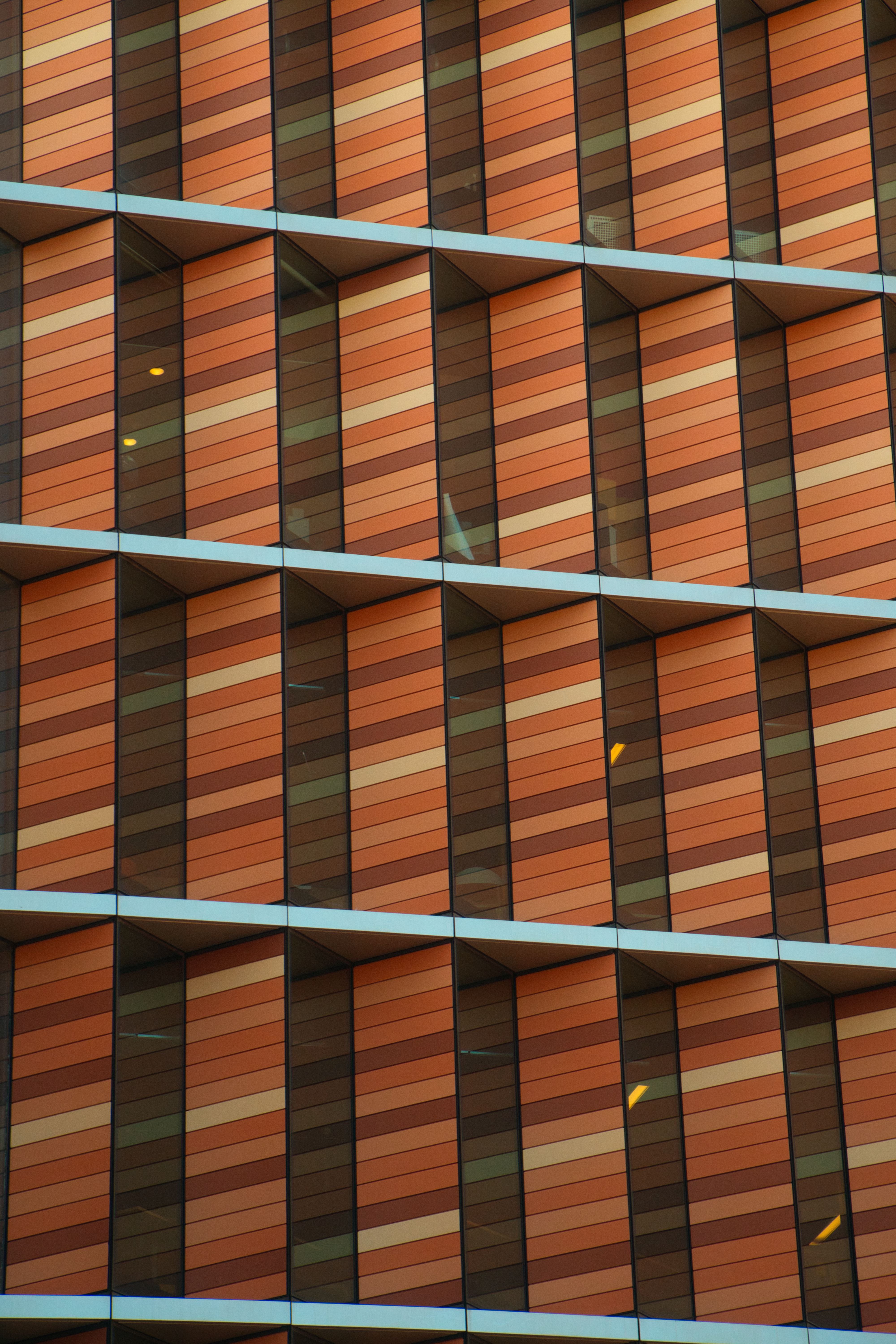 Close-up of a modern building facade with striking patterns and colors.