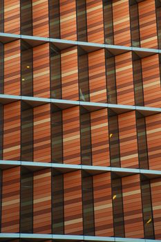 Close-up of a modern building facade with striking patterns and colors.