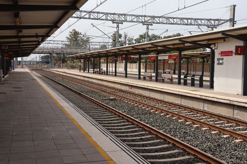 Free A quiet railway station in Puerto Real, Andalucía, showcasing empty platforms and tracks. Stock Photo