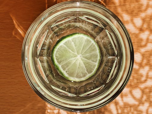 Clear Drinking Glass With Sliced Lemon