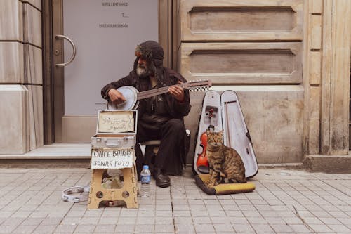 A Man Sitting on the Street