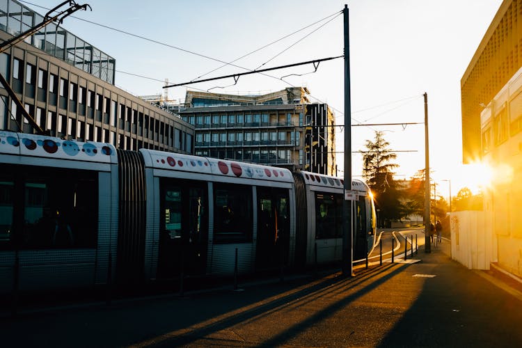 Tram Riding On City Street In Evening Time