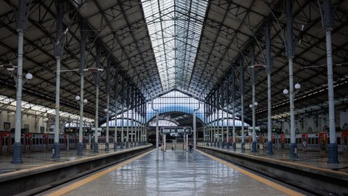 Free Empty urban train station in Lisbon, Portugal with classic architecture and natural light. Stock Photo