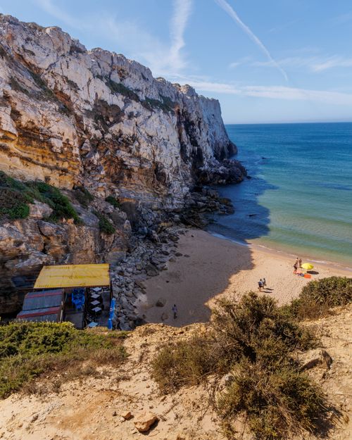 Free Stunning coastal cliffs and beach at Praia do Tonel in Sagres, Portugal, perfect for summer relaxation. Stock Photo