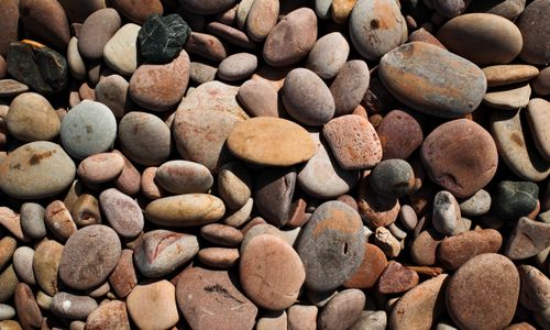 Free High-resolution image of smooth, colorful pebbles suitable for design and texture uses. Stock Photo