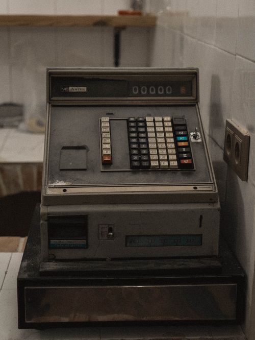 Free A vintage cash register with an industrial, rustic charm in an indoor setting. Stock Photo