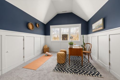 Free A bright home office featuring a yoga mat and contemporary decor, perfect for a peaceful work environment. Stock Photo
