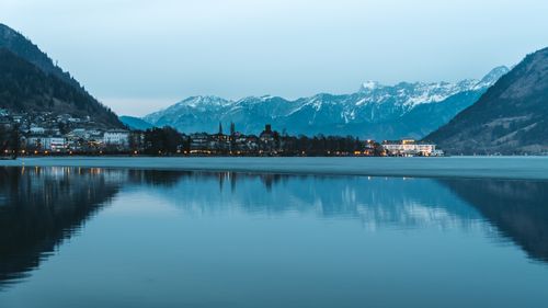 Free Captivating view of Zell am See with mountains reflecting on a tranquil lake at twilight. Stock Photo