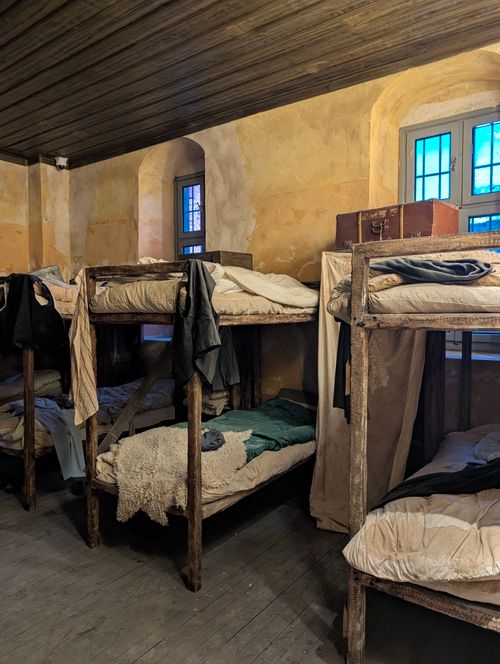 Free Vintage bunk beds inside Sinop Prison Museum, capturing historical Turkish penitentiary ambiance. Stock Photo