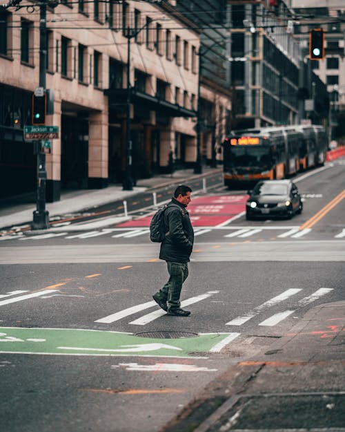 Man Walking On Pedestrian Lane