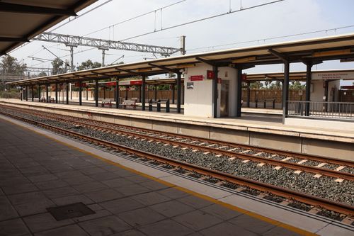Free An empty railway station platform in Puerto Real, Andalucía, Spain, under a clear sky. Stock Photo