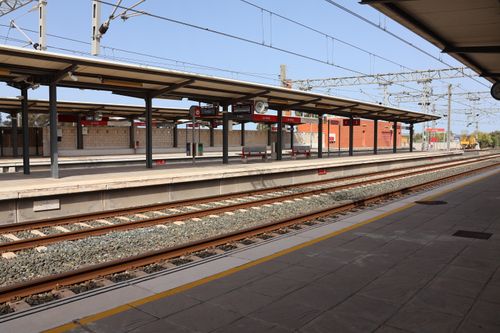 Free A quiet railway station platform with tracks and shelter in Puerto Real, Andalucia, Spain. Stock Photo