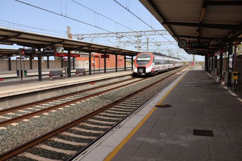Free Train arriving at Puerto Real station, Andalucía, Spain. Modern transportation hub. Stock Photo