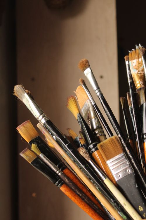 Free Close-up of various paintbrushes in a holder, capturing artistic creativity. Stock Photo