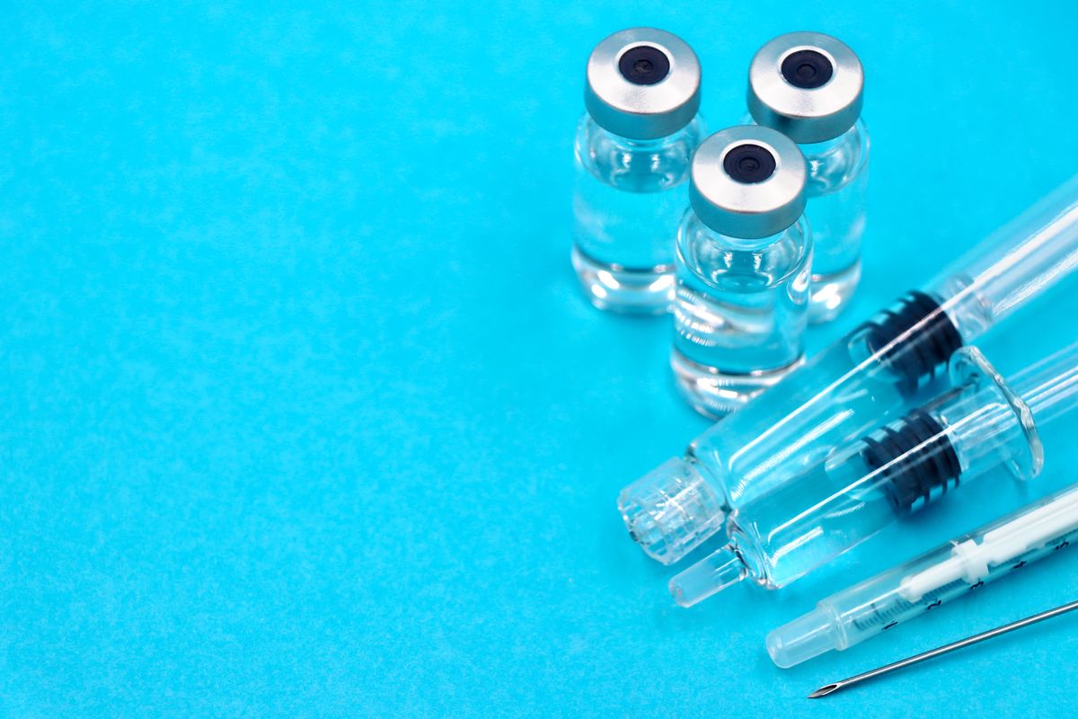 Vaccination equipment on blue background