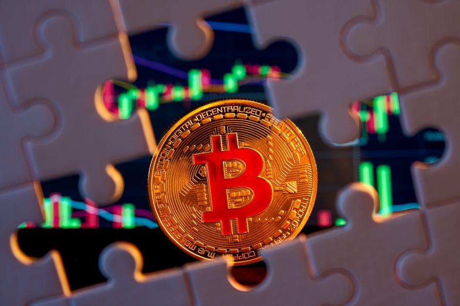 Gold Bitcoin on stock market graph background with puzzle pieces, symbolizing financial strategy.