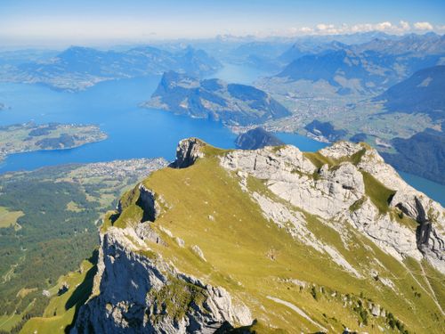 Free Stunning aerial view of the Swiss Alps with Lake Lucerne in the background during summer. Stock Photo