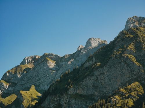Free Stunning view of Swiss Alps under clear blue skies. Perfect for adventure travelers. Stock Photo