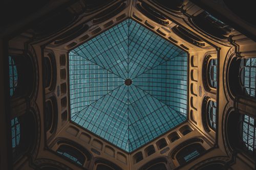 Free Dramatic view of a geometric glass ceiling in a historic building, showcasing intricate architectural details. Stock Photo