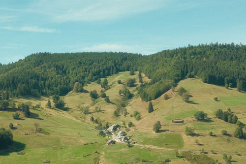 Free A picturesque landscape of the Black Forest hills with lush greenery and a quaint village. Stock Photo