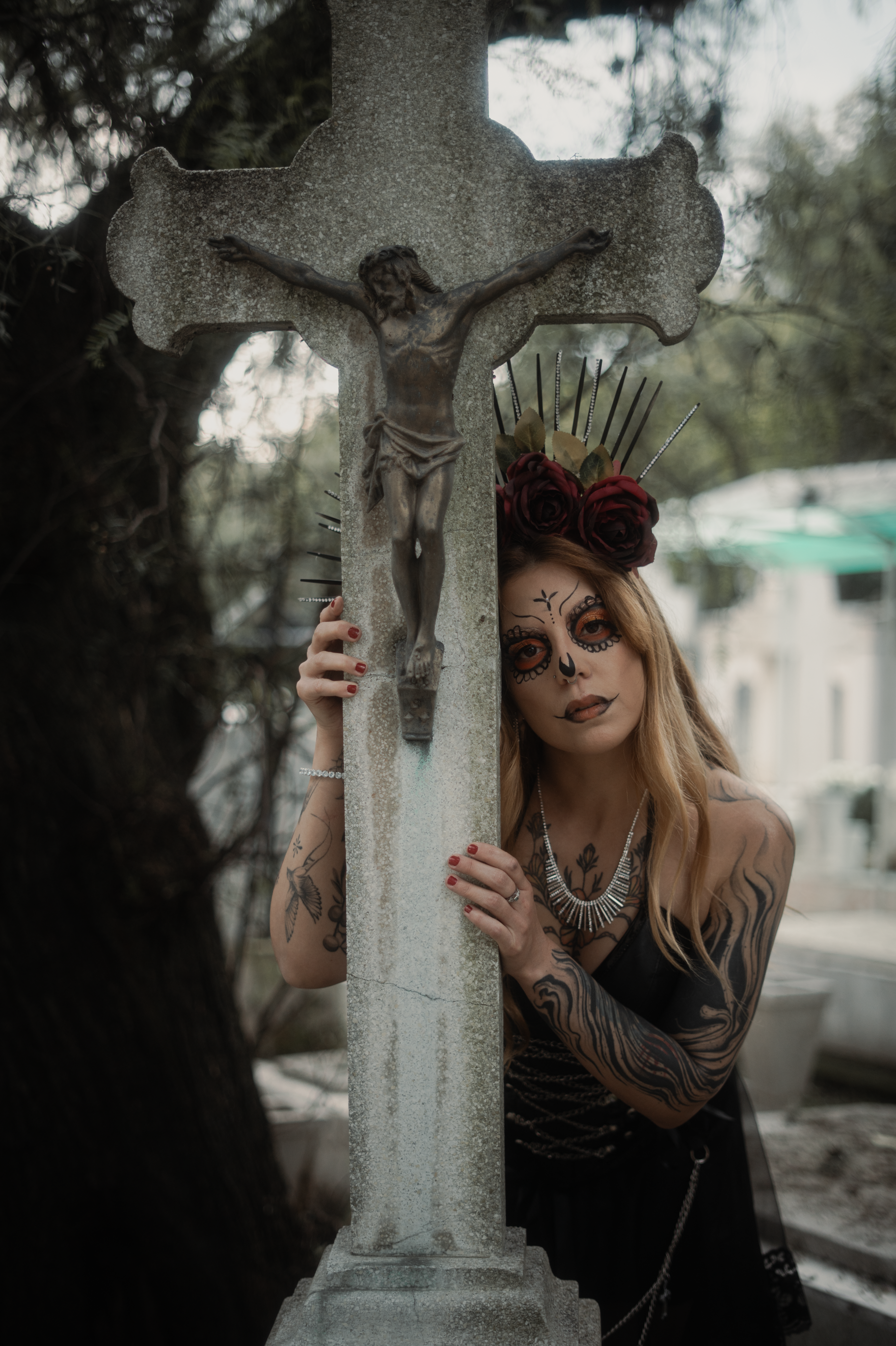 Day of the Dead celebration with Catrina makeup in a Mexico City cemetery.