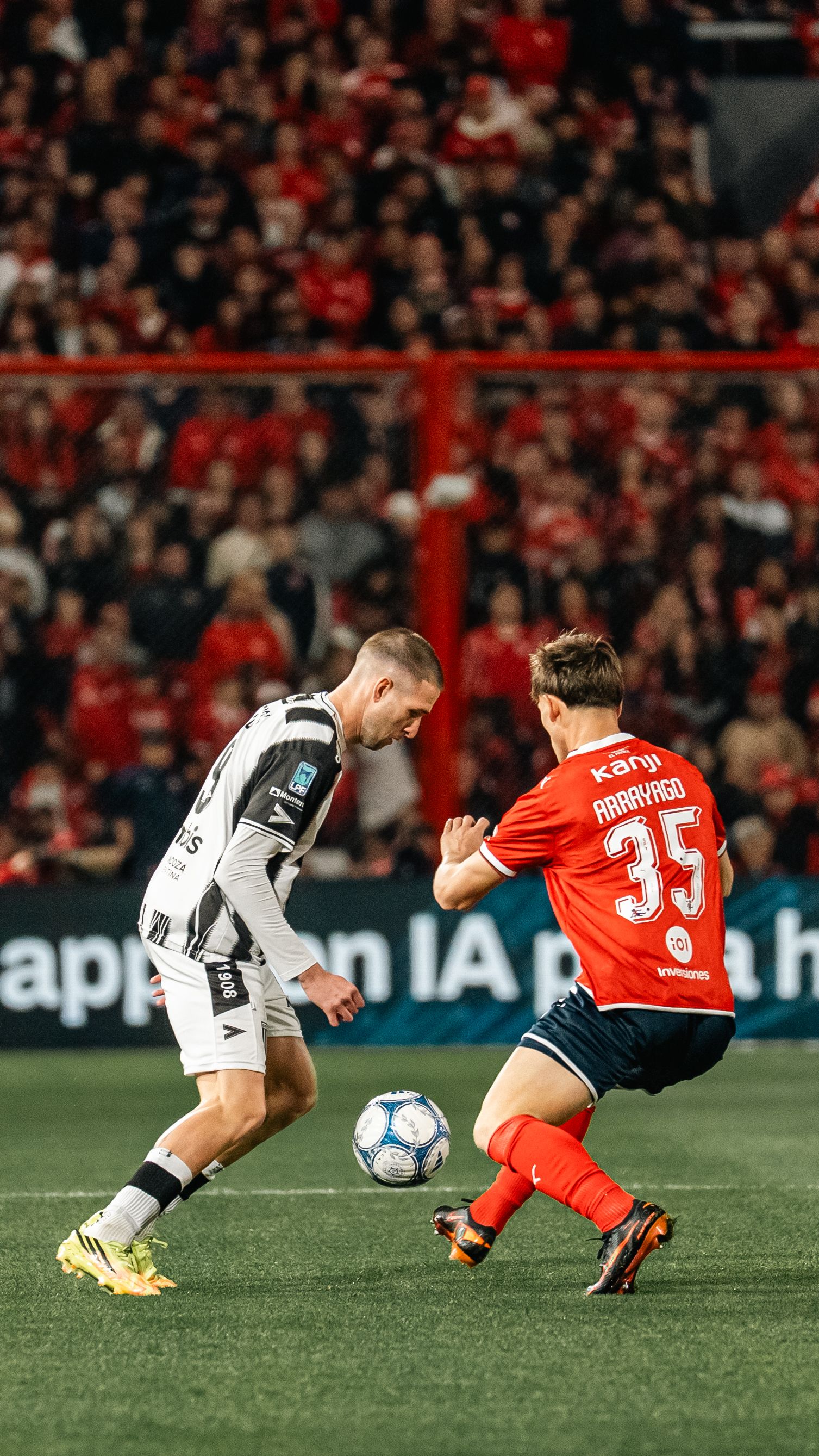 Dynamic soccer game with players in action, showcasing intense competition on the field.