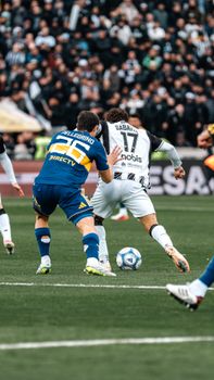 Exciting soccer match showcasing two teams in competition captured outdoors.