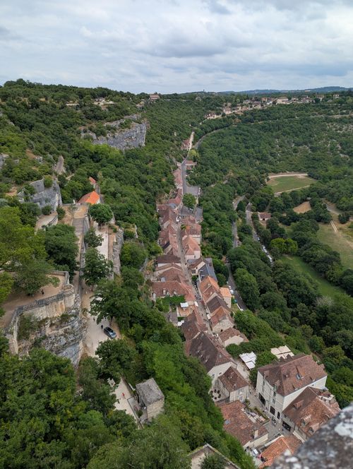 Free A breathtaking aerial view of the historic town Rocamadour located in Occitanie, France, surrounded by lush greenery. Stock Photo