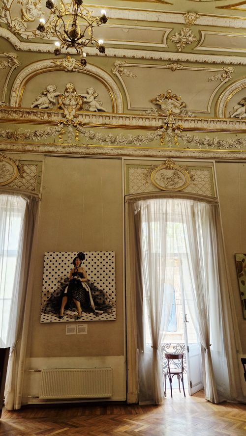 Free Luxurious European room featuring ornate ceiling, elegant decor, and classical architecture. Stock Photo
