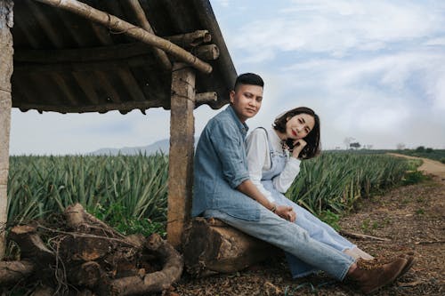 Man In Denim Top Sitting Beside A Woman 