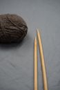 Brown Yarn on White Textile