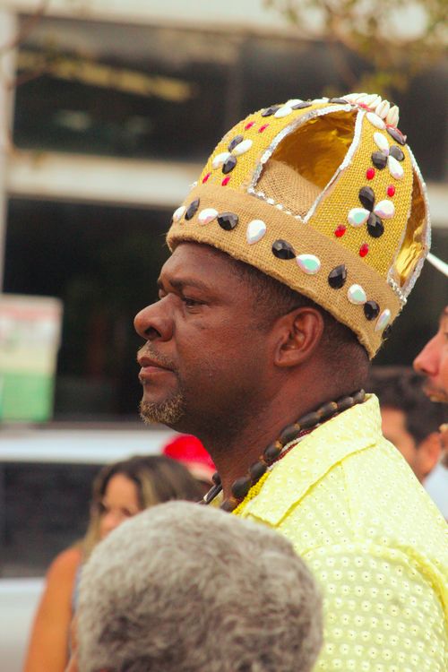 Free Portrait of an adult man wearing a decorative beaded crown, attending an outdoor cultural event. Stock Photo