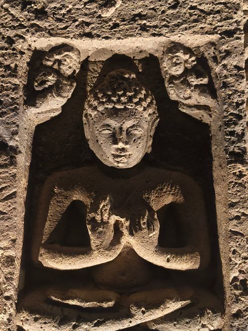 Free Intricate stone carving of Buddha from ancient Indian caves, highlighting cultural heritage. Stock Photo