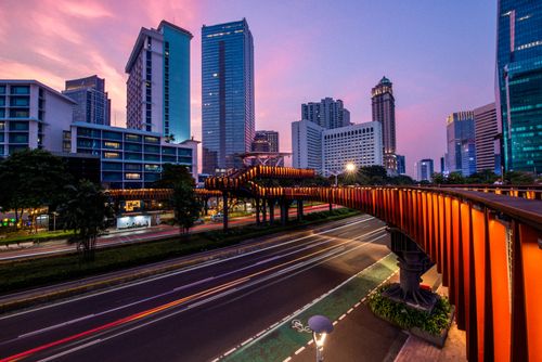 Free Stunning view of Jakarta's skyline during sunset showcasing the vibrant city lights and modern architecture. Stock Photo