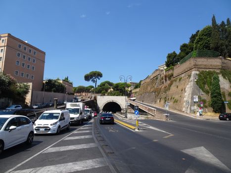 Vehicles pass through tunnels near the Vatican in sunny Rome, Italy.