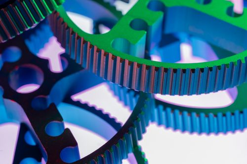 Free Vividly colored metal gears in a close-up shot, emphasizing industrial precision and mechanical design. Stock Photo
