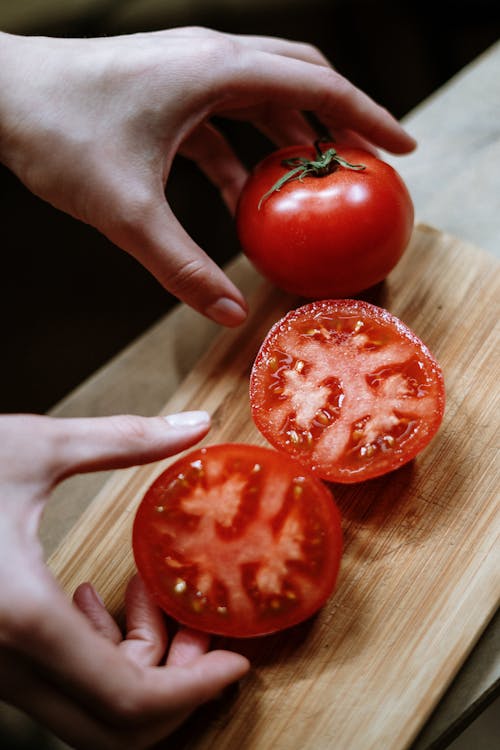 Person Holding Red Tomato Fruit