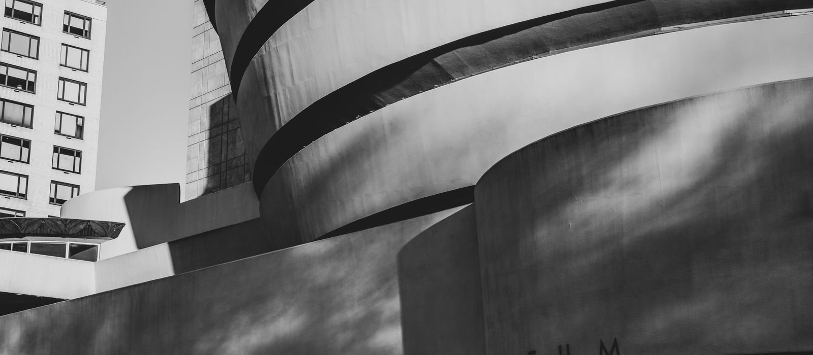 Striking black and white image of the Guggenheim Museum's iconic curves in New York City.