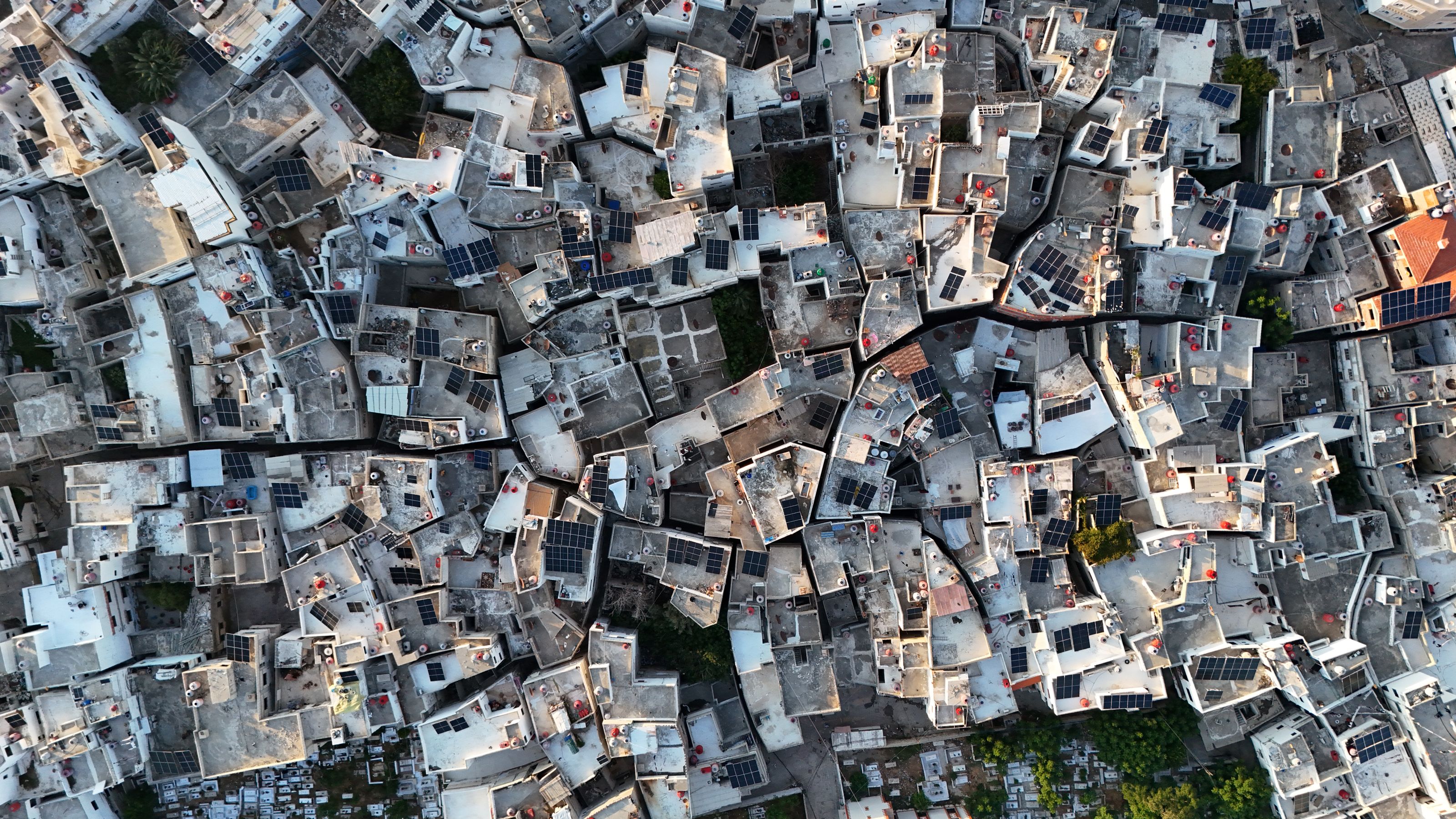 Stunning aerial perspective of densely packed rooftops in Tartus, Syria, showcasing urban residential architecture.