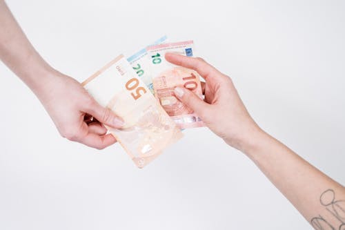 Person Holding 10 Euro Bill