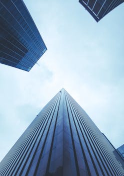 Low angle view of sleek modern skyscrapers in São Paulo, emphasizing architectural design.