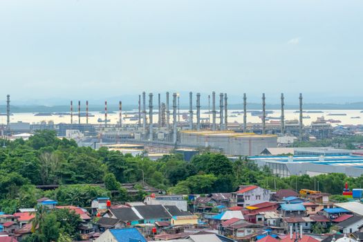 Overlooking Balikpapan's industrial area with factories and surrounding greenery.