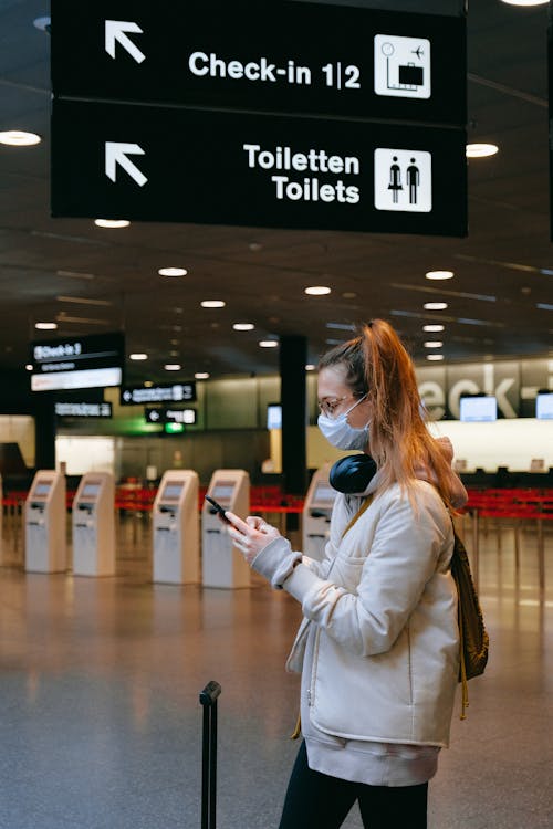 Woman With a Face Mask Texting