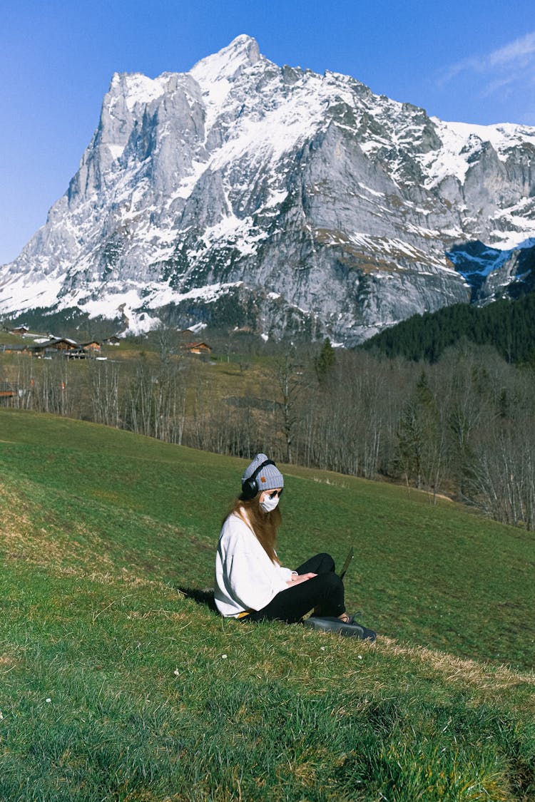 Woman Wearing Face Mask On Mountain