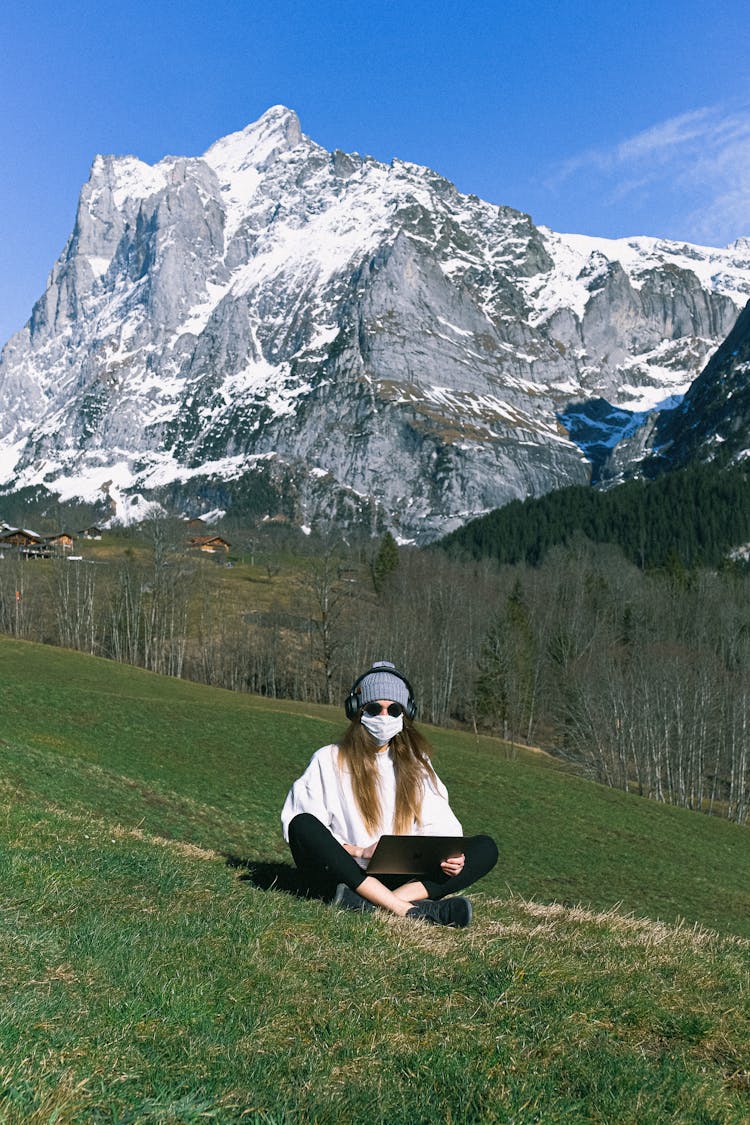 Woman Wearing Face Mask On Mountain