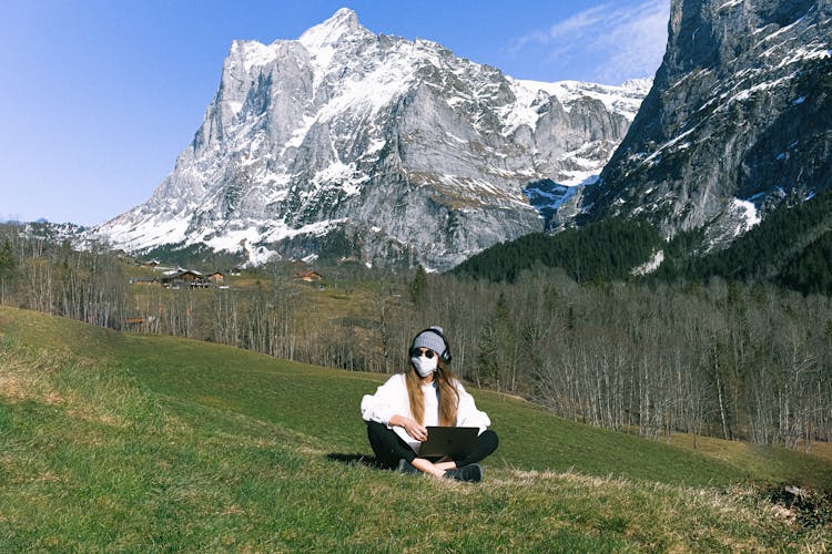 Woman Wearing Face Mask On Mountain