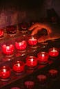 Red Candles on Clear Glass Containers
