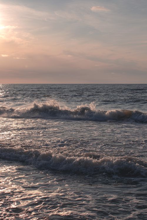 Free Captivating view of Baltic Sea waves at sunset with a tranquil sky. Stock Photo