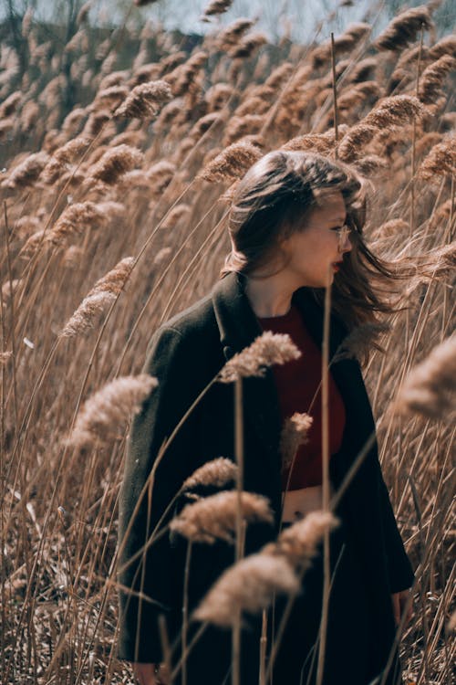 Woman Wearing Black Coat Standing On Wheat Field · Free Stock Photo