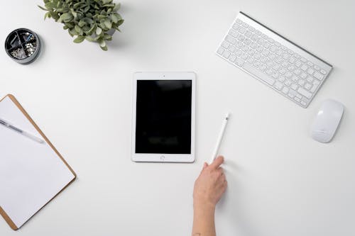 Free White Ipad on White Table Stock Photo